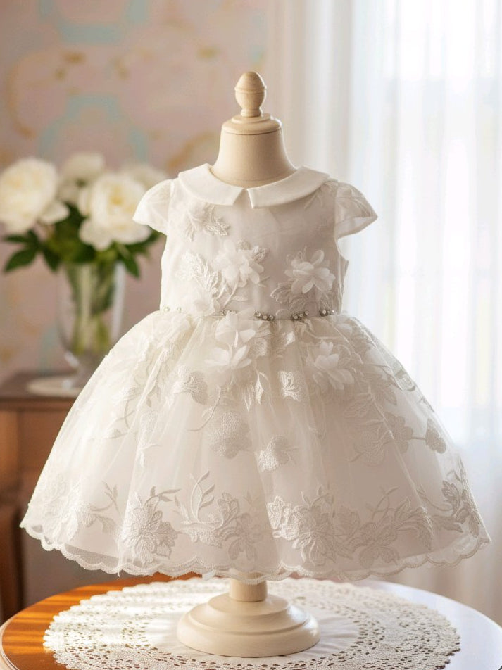 Robe de baptême bébé fille blanche avec fleurs brodées et bandeau assorti